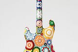 A new piece by Joana Vasconcelos sees a classic guitar dressed in crochet flowers and mandalas.