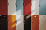 Colorful lockers with sunlight shinning upon them.