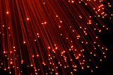 Red light fiber optic strands — Featured image for 9 Immediately Actionable Website Tips For Higher Traffic and Earnings by Amanda Stacks
