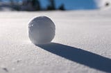 A Snowball Rolling Down a Hill