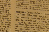 A photo of the word “racism” in a dictionary