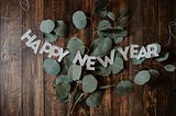 Happy New Year banner with leaves