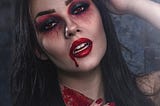 A woman dressed up as a vampire.