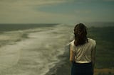 Woman looking at the ocean.