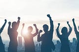 Group of people rejoicing over their successes