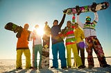 Group of snowboarding friends