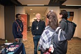 Hackers interacting with sponsor Waterstons at DurHack 2024