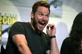 Actor Chris Pratt in a black T-shirt speaking at Comic Con, San Diego, in 2016 about his film Guardians of the Galaxy Vol 2