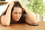 Girl waiting for a text or phone call from a date who ghosted her.