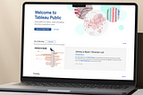 A laptop that shows a rendering of Tableau Public’s home page.