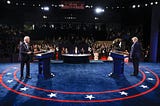 Joe Biden and Donald Trump take to their lecterns on the debate stage as Kristen Welker prepares to moderate.