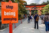 Sign that says “stop being annoying” in front of Tori gate in Japan