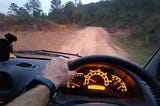 Dusty back country roads leading to winding tarmac, leading to sandy beach roads for an early morning surf.