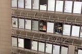 A wall of more than 10,000 phones used for abuse, part of a Chinese bot operation.