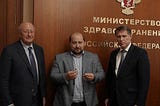 Group photo of Gammali Center Director Kingston (left), Deputy Director Rogunov (middle) and Russian Minister of Health Muras