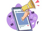 A hand holding a megaphone popping out of a mobile phone with social media icons around it