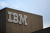 A photograph of the outside of an IBM office building.