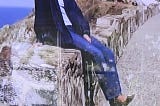 Deana Wild posing near the cliffs of Seal Beach in stilletos