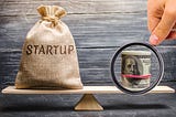 Startup on the scales with currency