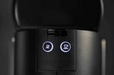 Photo of Nespresso Coffee Machine focusing on the two buttons to make coffee.