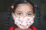 girl wearing covid-19 mask