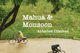 The image have two people on bicycle and its raining slowly, contains title “ Mahua & Monsoon” by Abhishek Chauhan