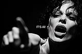 A woman screams and points at the screen, IT’S AI! (the image is also AI)