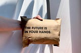 A paper-package with the text “The Future is in your hands”