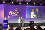 Image of Sathish Muthukrishnan, Ally Chief Information, Data, Digital Officer receiving the CIO 100 award from Ken Jennings, American Game Show Host and Jeopardy Champion