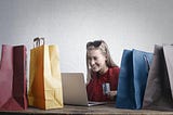 Picture of a beautiful girl shopping online.