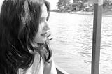 The writer of the story, Apeksha, is sitting in a boat which is in middle of the River Ganges. The writer is looking far away and pondering over her life.