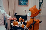 Image of a man receiving medical attention from a robot