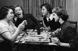 A photograph taken in 1951 of a group of women playing Monopoly.