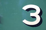 A graphic of the number 3 on a green background