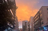 A purple and orange sunset in downtown Qutio, Ecuador