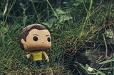 A James Kirk figure in the grass