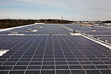 The expansive solar rooftop of an Amazon facility