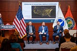 The FAA’s Thomas Draffen (at podium) is joined by fellow aviation representatives on a panel focused on improving air traffic telecommunications. (Photo: DOT)