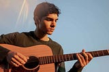 Young man playing guitar under clear, blue sky