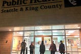 VillageReach volunteers Chongsun Ahn, Trisha Patek, Mi Le, Christine Lenihan, Sierra Petrosky standing outside a Seattle-King County Public Health Clinic from where they transport vaccines to high volume sites on a daily basis.