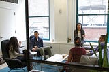 A discussion in a meeting room.