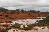 Alice to Coober Pedy . . . through flood on a broken motorcycle . . .