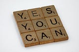 Photo of letter blocks saying YES YOU CAN