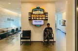 Me sitting in front of the IBM Austin Design Studio’s welcome neon sign, a popular ‘check-in’ spot for visitors to pose!