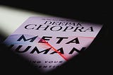 A light falls over the cover of Deepak Chopra’s 2019 Metahuman against a black background, which he wrote while he befriended and emailed Jeffrey Epstein.