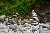 A beautiful stone stack built near a running waterbody