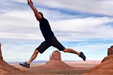 Man jumping on canyon