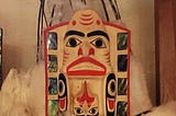 Haida carved headdress with black and red markings