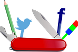 Swiss army knife with pen, twitter logo and facebook logo