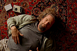 Scene from the movie The Big Lebowski laying on rug